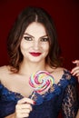 Beautiful woman, Lollipop in hand Royalty Free Stock Photo