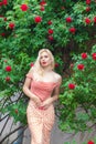 Beautiful woman with long blonde hair and red lips wearing pink clothes Royalty Free Stock Photo