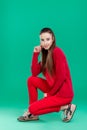 Woman in red sweater on green background Royalty Free Stock Photo