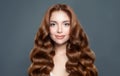 Beautiful woman with long healthy curly hairstyle. Hair care and coloring concept
