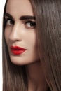 Beautiful woman with long straight hair, strong eyebrows & red lips make-up Royalty Free Stock Photo