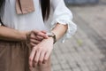 Beautiful woman looking at her watch Royalty Free Stock Photo
