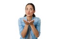 beautiful woman looking straight ahead blowing a kiss Royalty Free Stock Photo