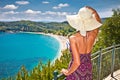 Beautiful woman looking on Valtos beach near Parga, Greece.