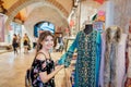 Beautiful woman looks oriental clothes in Egypt Bazaar