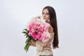 Beautiful woman with lots of pink flowers in her hands. Sexy woman with long hair Royalty Free Stock Photo