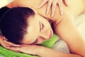 Beautiful woman lying on bed in spa salon. Royalty Free Stock Photo