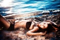 Beautiful woman lying down on a beach Royalty Free Stock Photo