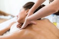 Beautiful woman lying down on the bed relax in spa salon with oil massage. selective focus  on hand Royalty Free Stock Photo