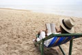 A woman lying down and reading book on the beach chair with feeling relaxed Royalty Free Stock Photo