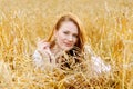 Beautiful woman lying in a field of wheat Royalty Free Stock Photo