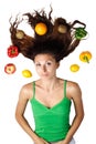 Beautiful woman lying with fruits and hair