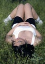 Beautiful woman lying on grass