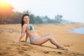 Beautiful woman lying on the sand on the beach in summer. Summer vacation happiness carefree joyful woman