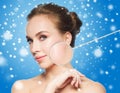 Beautiful woman with magnifier on face over snow Royalty Free Stock Photo