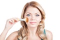 Beautiful woman with Makeup Brush. Royalty Free Stock Photo