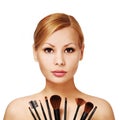 Beautiful woman with makeup brushes, isolated Royalty Free Stock Photo