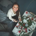 Beautiful Woman Making Christmas Garland with Glass Balls Royalty Free Stock Photo