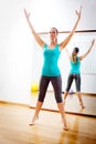 Beautiful woman making fitness exercises stretching witn open arms