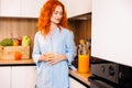 Beautiful woman making orange juice. Healthy eating lifestyle concept portrait of beautiful young woman preparing juice Royalty Free Stock Photo