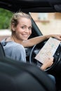 beautiful woman with map in car Royalty Free Stock Photo