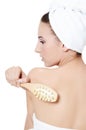 Woman with a massage brush. SPA concept. Royalty Free Stock Photo