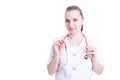 Beautiful woman in medical uniform holding a stethoscope Royalty Free Stock Photo