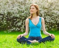 Beautiful woman meditating outdoors Royalty Free Stock Photo