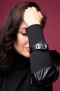 Beautiful woman middle age wearing black watch. Wrist shot Royalty Free Stock Photo