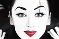 Beautiful woman mime with blue eyes