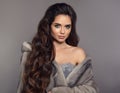 Beautiful woman in mink fur coat. Winter portrait of fashionable brunette girl with long healthy hair posing in fashion outfit Royalty Free Stock Photo