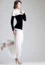 Beautiful woman model posing in elegant dress in the studio Royalty Free Stock Photo