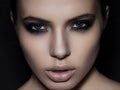 Beautiful woman model smokey eyes makeup closeup on black Royalty Free Stock Photo