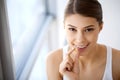 Beautiful Woman Mouth Holding Pill For Teeth. Girl Taking Vitamins Royalty Free Stock Photo