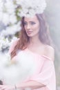 Beautiful woman - near the flowering trees Royalty Free Stock Photo