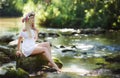 Beautiful woman near a mountain river Royalty Free Stock Photo