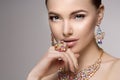 Beautiful woman in a necklace, earrings and ring. Model in jewel Royalty Free Stock Photo