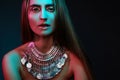 Beautiful woman in a necklace. Model in jewelry from silver. Beautiful indian jewellery. Bright lights Royalty Free Stock Photo