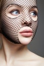 Beautiful Woman in Net on her Face. Girl in mask