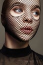 Beautiful Woman in Net on her Face. Sexy Girl in mask Royalty Free Stock Photo