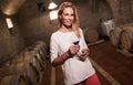 Beautiful woman oenologist tasting wine Royalty Free Stock Photo