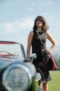 Beautiful woman and old car, sixties style