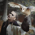 Beautiful woman and open winged owl