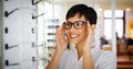 Beautiful woman with optician trying eyeglasses Royalty Free Stock Photo