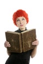 Beautiful woman, orange wig reading old book