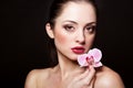 Beautiful woman with orchid flower Royalty Free Stock Photo