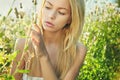 Beautiful woman outdoors enjoying nature in dress at summer mead Royalty Free Stock Photo