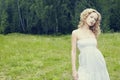 Beautiful woman outdoors enjoying nature in dress at summer mead Royalty Free Stock Photo