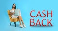 Beautiful woman with paper shopping bags in armchair and words Cash Back on light blue background. Banner design Royalty Free Stock Photo