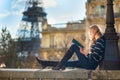 Beautiful woman in Paris, reading a book Royalty Free Stock Photo